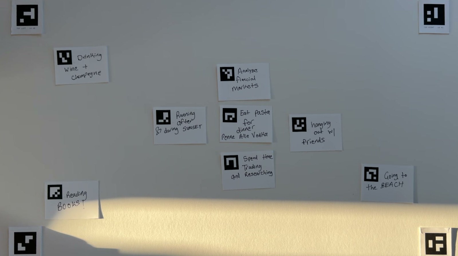 The paper field photographed from above and squared to its four corner markers: eight handwritten cards spread across it.